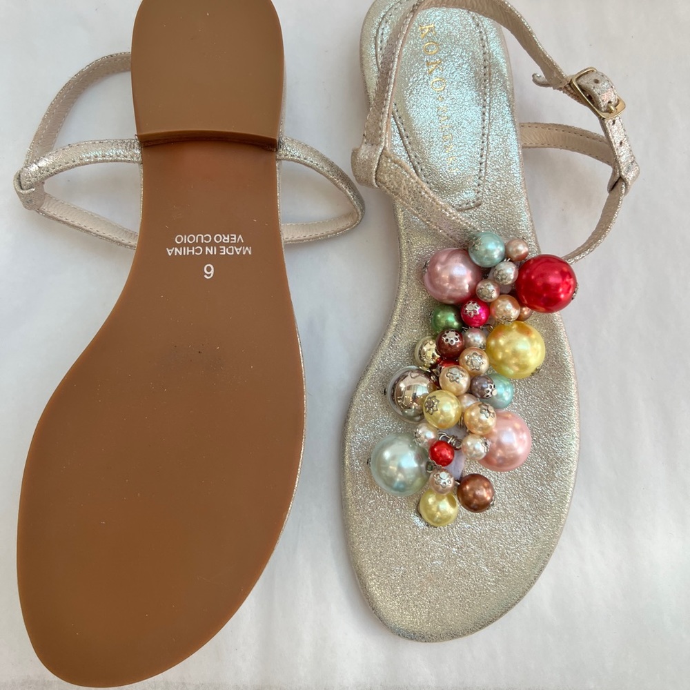 Brand new sandals with colorful ball detail.